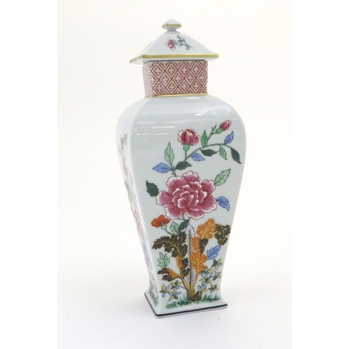 133 - A Portuguese Vista Alegre lidded vase with hand painted floral decoration. Approx. 10 1/4