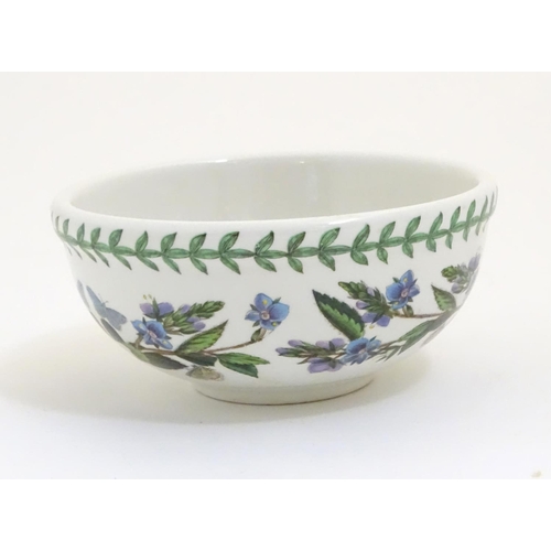 185 - Five items of Portmeirion wares comprising a large bowl, an oval serving plate, two dishes and a cer... 