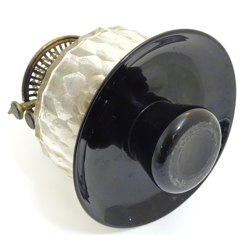 1524 - A 19thC oil lamp, the black glass base with facet cut glass reservoir and white milk glass shade. Th... 