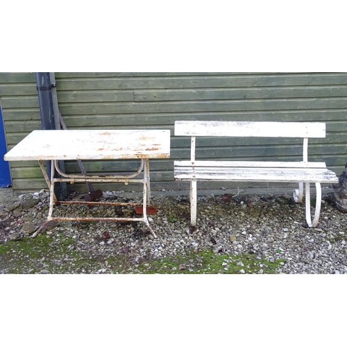 1543 - A Victorian garden bench with wrought iron mounts and wooden slatted seat, white painted finish, tog... 