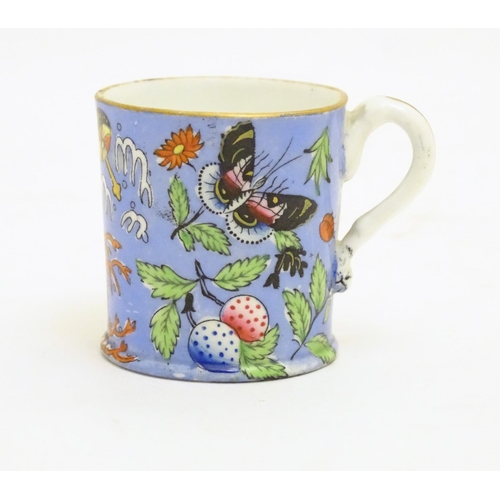 102 - A 19thC coffee cup with hand painted decoration depicting butterflies, strawberries and foliage. App... 