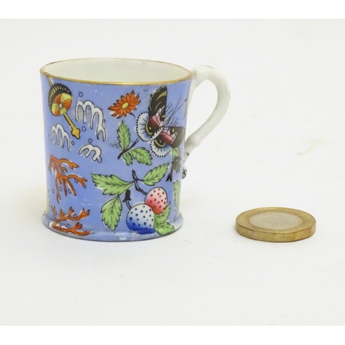 102 - A 19thC coffee cup with hand painted decoration depicting butterflies, strawberries and foliage. App... 