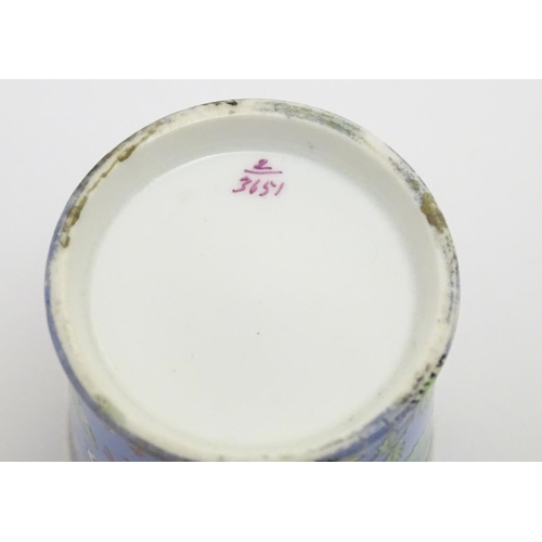 102 - A 19thC coffee cup with hand painted decoration depicting butterflies, strawberries and foliage. App... 