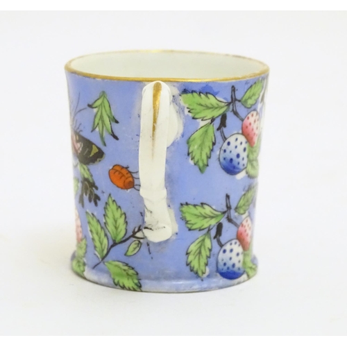 102 - A 19thC coffee cup with hand painted decoration depicting butterflies, strawberries and foliage. App... 