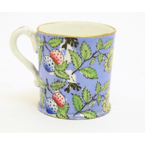 102 - A 19thC coffee cup with hand painted decoration depicting butterflies, strawberries and foliage. App... 