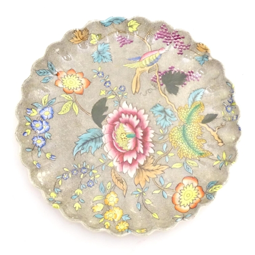 104 - A Copeland plate with scalloped rim with floral, foliate and bird detail. Impressed marks under. App... 