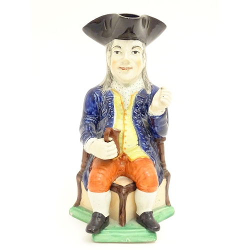 120 - A large Toby jug formed as a seated gentleman in a tricorn hat with a tankard of ale. Approx. 10 3/4... 