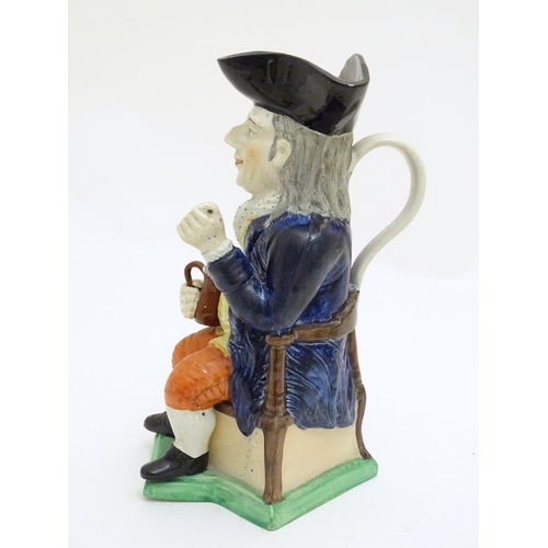 120 - A large Toby jug formed as a seated gentleman in a tricorn hat with a tankard of ale. Approx. 10 3/4... 