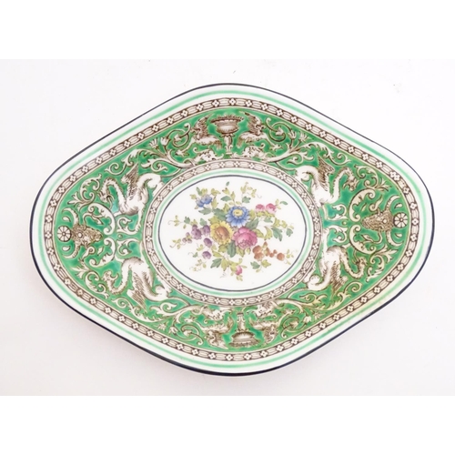 123 - A Wedgwood dish of lozenge form in the pattern Florentine with a central floral motif and green grou... 