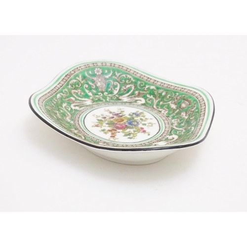 123 - A Wedgwood dish of lozenge form in the pattern Florentine with a central floral motif and green grou... 