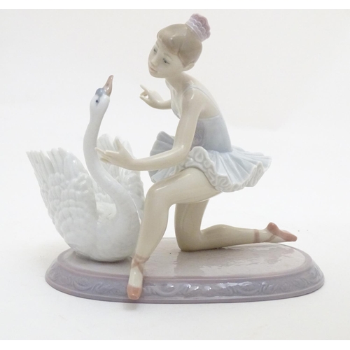 126 - A Lladro ballet dancer and a swan on an oval base, Graceful Dance, model no. 6205. Marked under. App... 