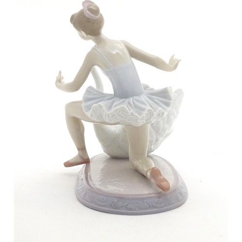 126 - A Lladro ballet dancer and a swan on an oval base, Graceful Dance, model no. 6205. Marked under. App... 