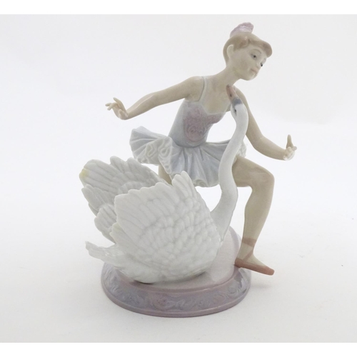 126 - A Lladro ballet dancer and a swan on an oval base, Graceful Dance, model no. 6205. Marked under. App... 