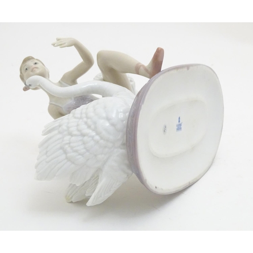 126 - A Lladro ballet dancer and a swan on an oval base, Graceful Dance, model no. 6205. Marked under. App... 