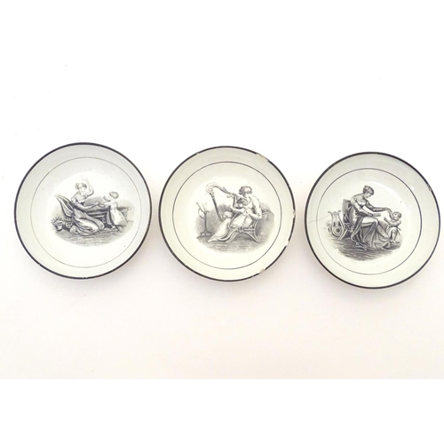 130 - Three small 19thC monochrome dishes, each depicting a mother and child playing. Approx. 4 1/4