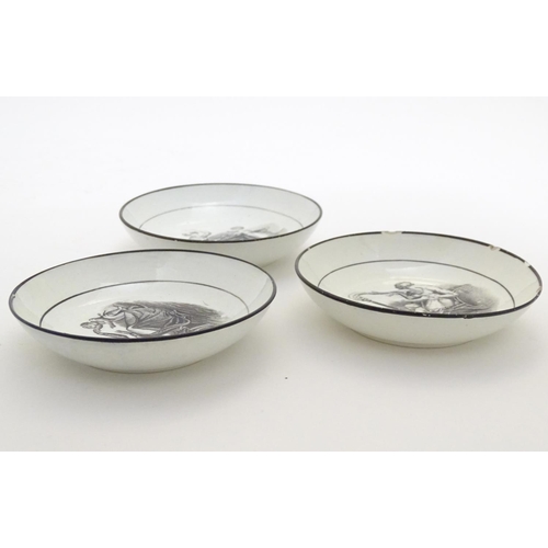 130 - Three small 19thC monochrome dishes, each depicting a mother and child playing. Approx. 4 1/4