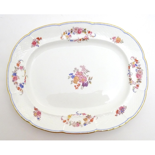 137 - A 19thC Mintons oval serving plate with a lobed rim decorated with floral motifs and gilt highlights... 