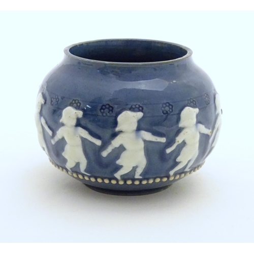 146 - A Doulton Lambeth style circular pot with banded decoration depicting dancing children. Marked under... 