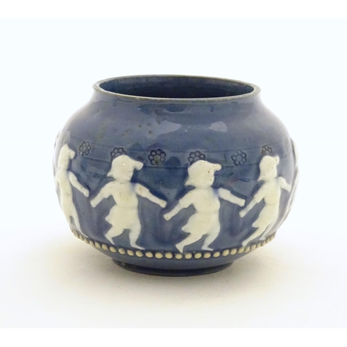 146 - A Doulton Lambeth style circular pot with banded decoration depicting dancing children. Marked under... 