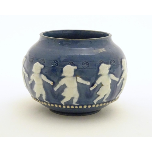 146 - A Doulton Lambeth style circular pot with banded decoration depicting dancing children. Marked under... 