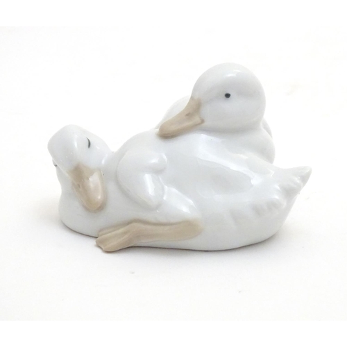 147 - A Nao model of two sleeping ducks. Marked under. Approx. 2 1/4