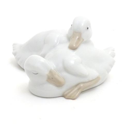 147 - A Nao model of two sleeping ducks. Marked under. Approx. 2 1/4