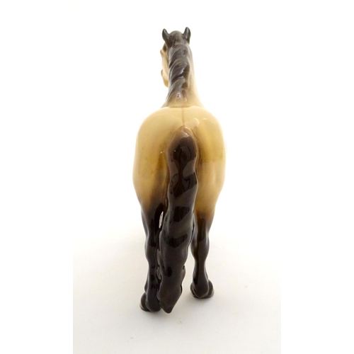 153 - A Beswick Highland dun pony / horse, model no. 1644, designed by Arthur Gredington. Marked under. Ap... 