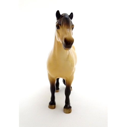 153 - A Beswick Highland dun pony / horse, model no. 1644, designed by Arthur Gredington. Marked under. Ap... 