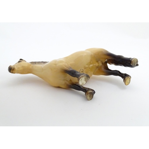 153 - A Beswick Highland dun pony / horse, model no. 1644, designed by Arthur Gredington. Marked under. Ap... 