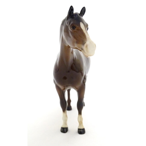 155 - A Beswick Highland brown Bois Roussel race horse, model no. 701, designed by Arthur Gredington. Mark... 