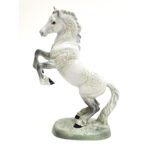 156 - A Beswick Welsh cob horse rearing, model no. 1014, designed by Arthur Gredington. Marked under. Appr... 