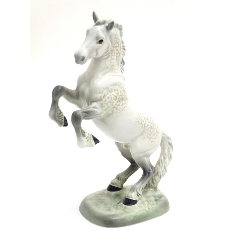 156 - A Beswick Welsh cob horse rearing, model no. 1014, designed by Arthur Gredington. Marked under. Appr... 