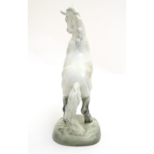 156 - A Beswick Welsh cob horse rearing, model no. 1014, designed by Arthur Gredington. Marked under. Appr... 