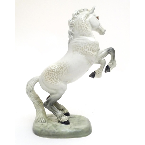 156 - A Beswick Welsh cob horse rearing, model no. 1014, designed by Arthur Gredington. Marked under. Appr... 