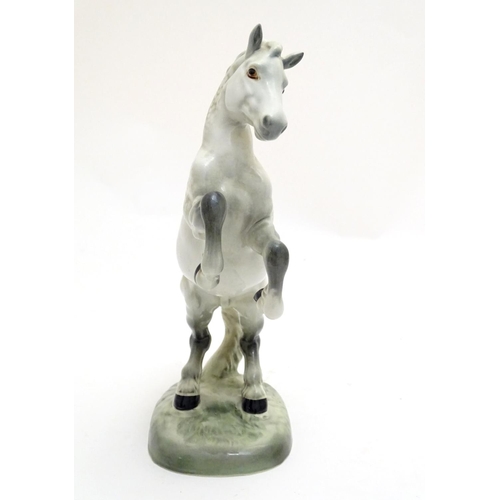 156 - A Beswick Welsh cob horse rearing, model no. 1014, designed by Arthur Gredington. Marked under. Appr... 