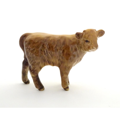 157 - A Beswick Highland calf, model no. 1827D, designed by Arthur Gredington. Marked under. Approx. 3