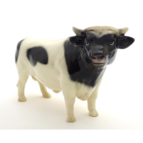 158 - A Coopercraft Friesian bull in the manner of Beswick. Marked Made in England under. Approx. 6 1/4