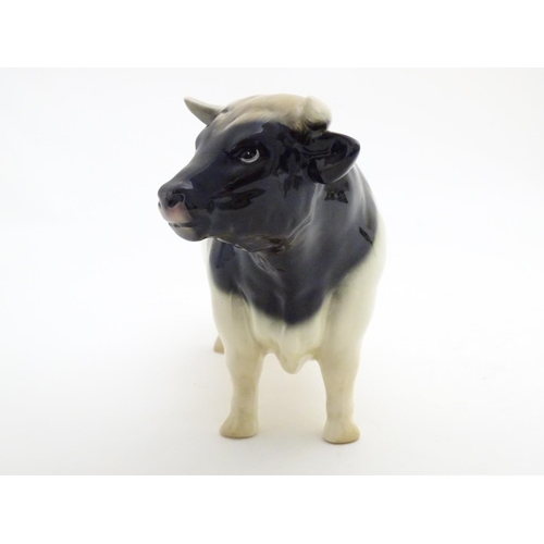 158 - A Coopercraft Friesian bull in the manner of Beswick. Marked Made in England under. Approx. 6 1/4