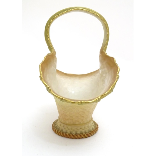 161 - A Royal Worcester blush basket with loop handle. Marked under. Approx. 7 1/4