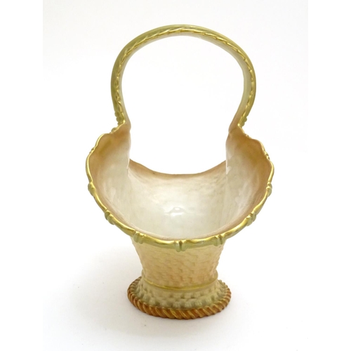 161 - A Royal Worcester blush basket with loop handle. Marked under. Approx. 7 1/4