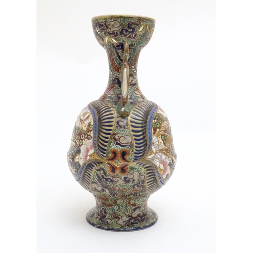 180 - Three assorted Oriental items comprising a large Japanese vase with twin handles decorated with flow... 