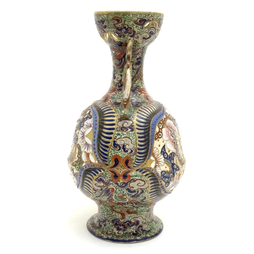 180 - Three assorted Oriental items comprising a large Japanese vase with twin handles decorated with flow... 