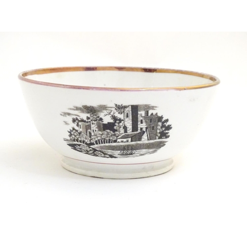 65 - A 19thC bowl with monochrome transfer decoration depicting a river landscape with a ship and castle ... 