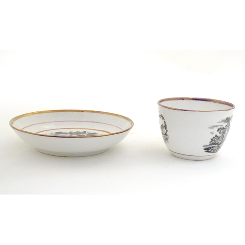 66 - A 19thC tea cup and saucer with monochrome transfer decoration depicting a river landscape with a sh... 