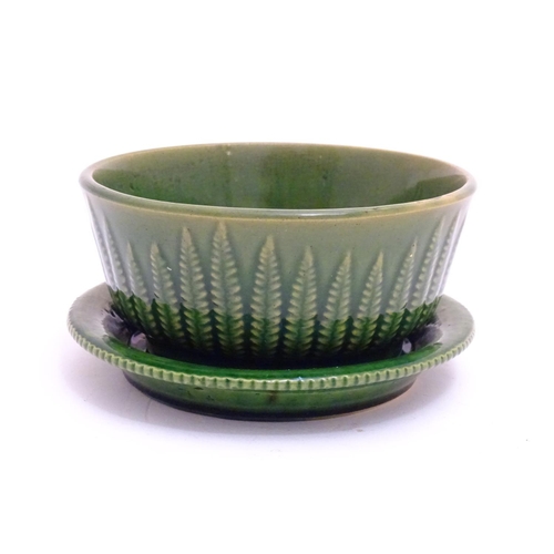 67 - A Wedgwood style green bowl / plant pot with relief fern detail. Together with an associated stand w... 