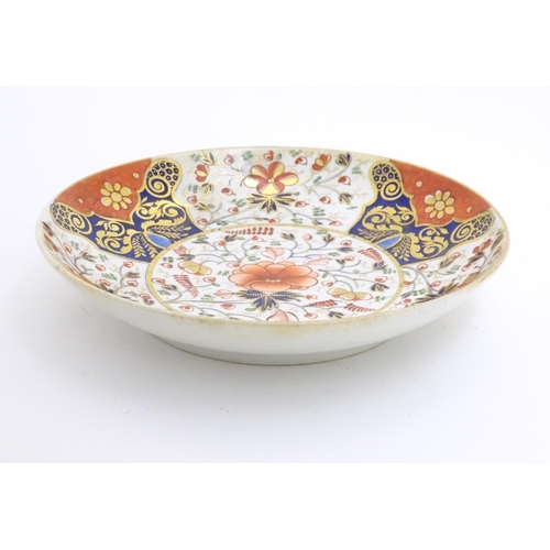 72 - A 19thC Derby dish with hand painted floral and foliate detail in the Imari palette. Marked under. A... 