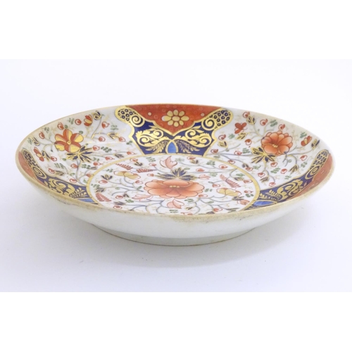 72 - A 19thC Derby dish with hand painted floral and foliate detail in the Imari palette. Marked under. A... 