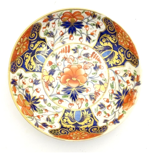 73 - A 19thC Derby dish with hand painted floral and foliate detail in the Imari palette. Marked under. A... 