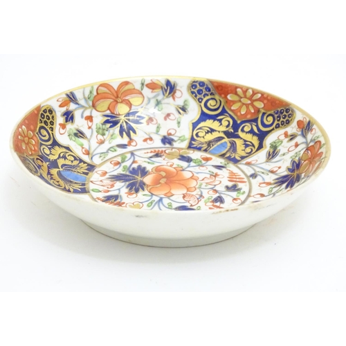 73 - A 19thC Derby dish with hand painted floral and foliate detail in the Imari palette. Marked under. A... 