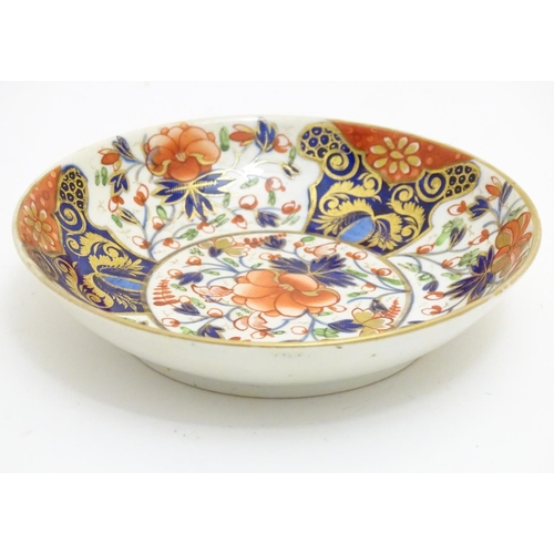 73 - A 19thC Derby dish with hand painted floral and foliate detail in the Imari palette. Marked under. A... 